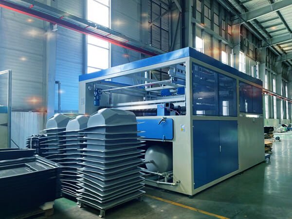 thermoforming machine working in the factory